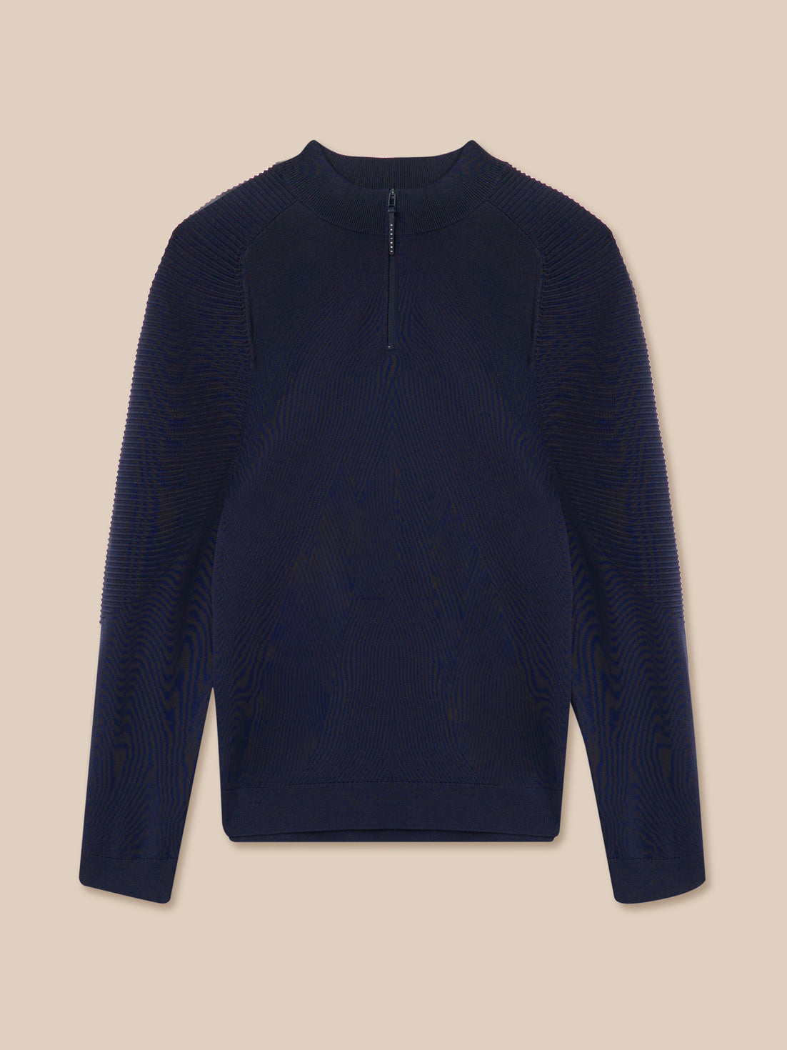 Navy blue long-sleeve shirt on a beige background