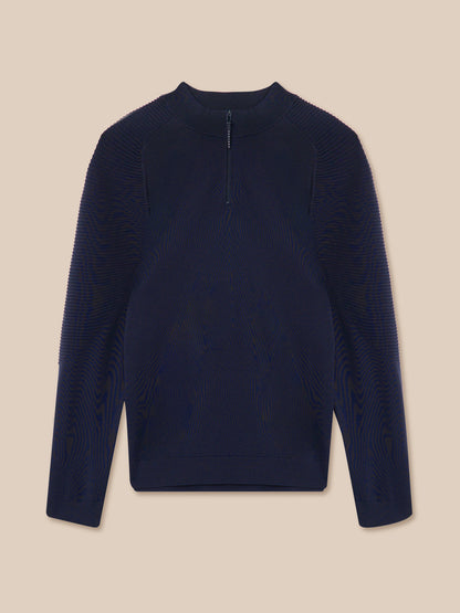Navy blue long-sleeve shirt on a beige background