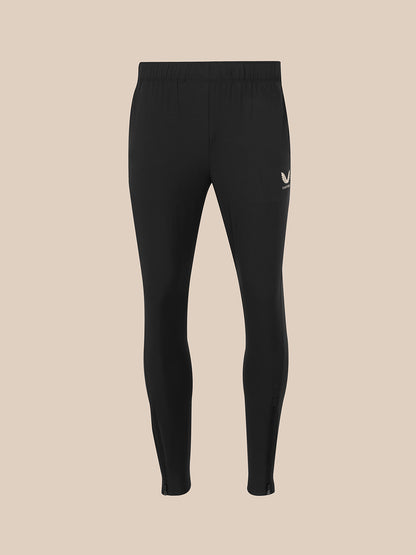 Black full-length leggings shown flat against a solid beige background.