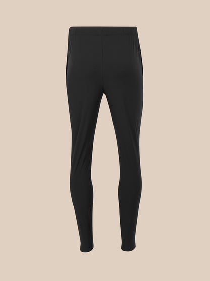 Black full-length leggings shown flat against a solid beige background.