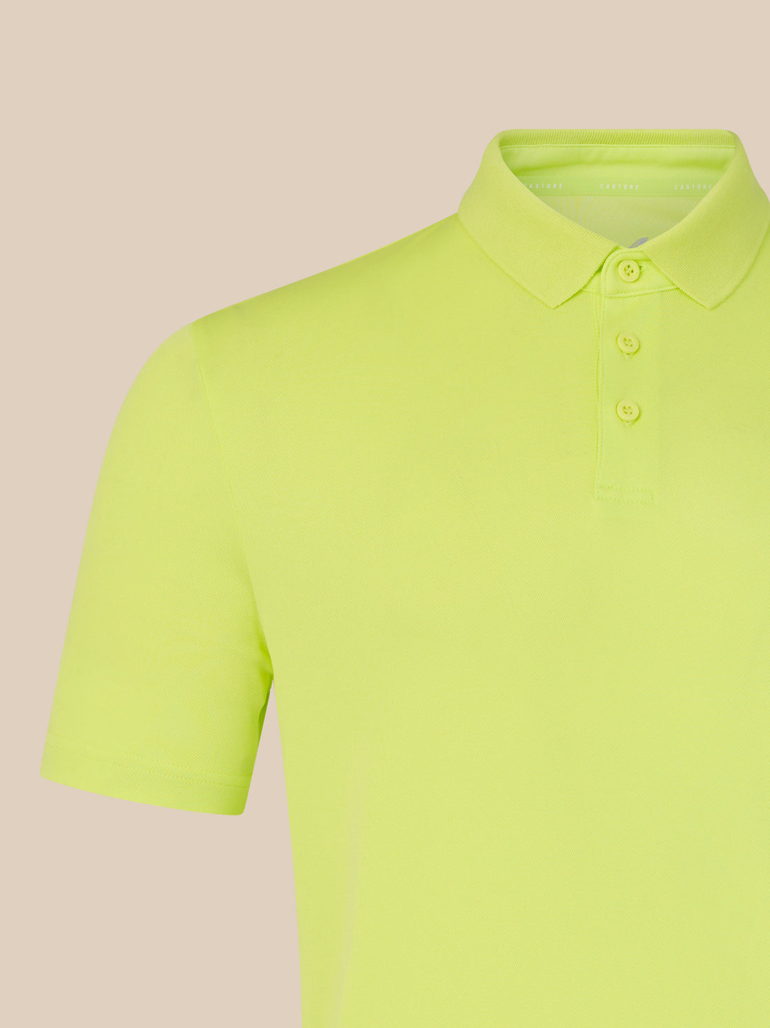 Yellow polo shirt on a beige background