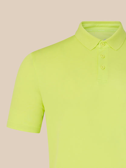 Yellow polo shirt on a beige background