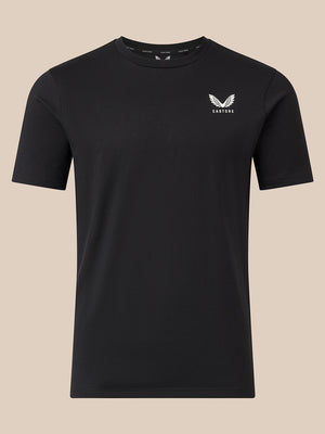 A black short-sleeve crewneck t-shirt with a small white winged logo and the word 'CASTORE' printed on the left chest, displayed against a solid beige background.