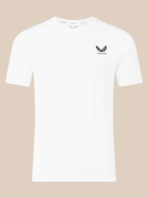 A white short-sleeve crewneck t-shirt with a small black winged logo and the brand name 'CASTORE' printed on the left chest, displayed against a solid beige background.