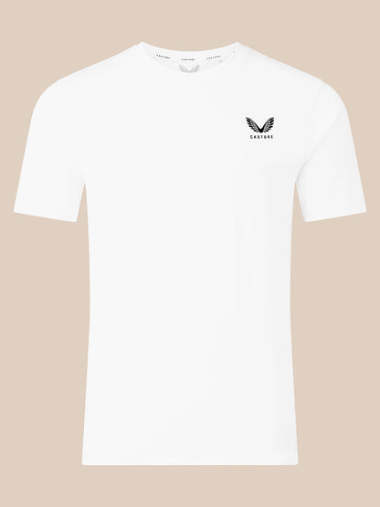 A white short-sleeve crewneck t-shirt with a small black winged logo and the brand name 'CASTORE' printed on the left chest, displayed against a solid beige background.