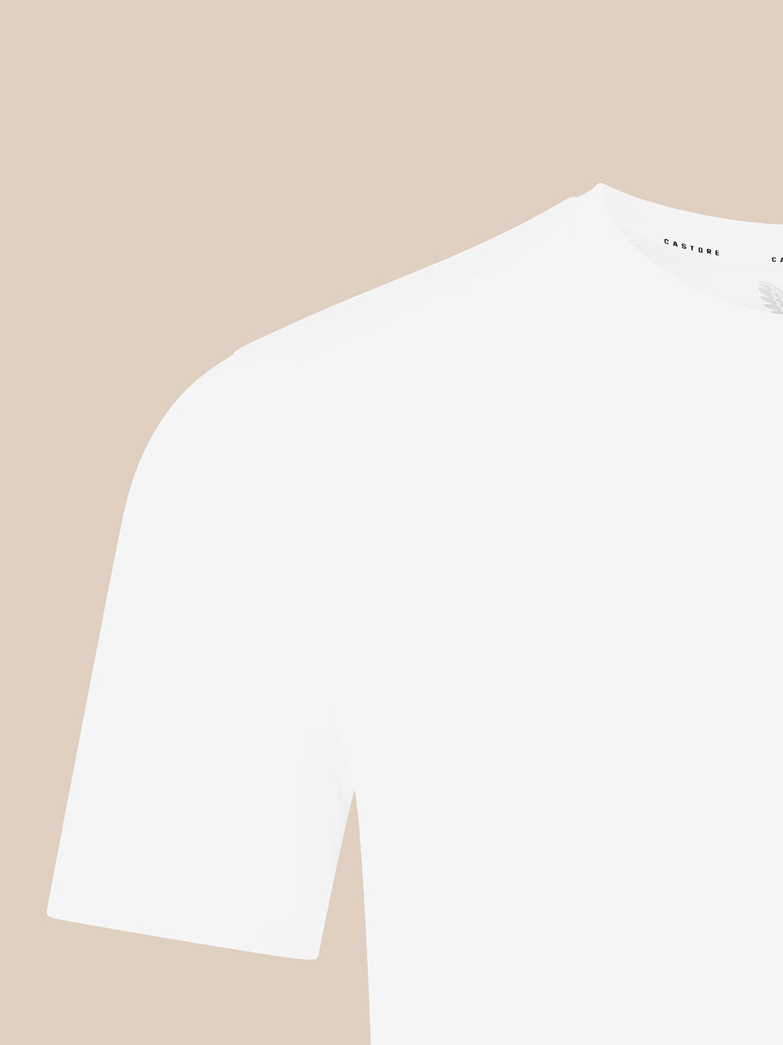 A close-up of a white short-sleeve crewneck t-shirt on a solid beige background.