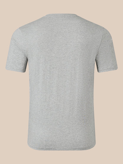 A light gray heather short-sleeve t-shirt shown from the back, displayed on a solid beige background.