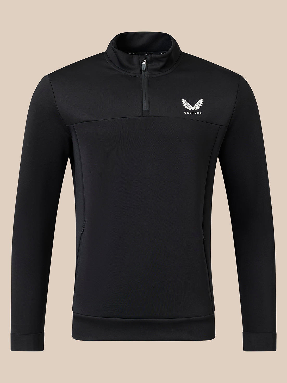A black long-sleeve quarter-zip pullover with a small white winged logo and the brand name 'CASTORE' on the left chest, displayed on a solid beige background.