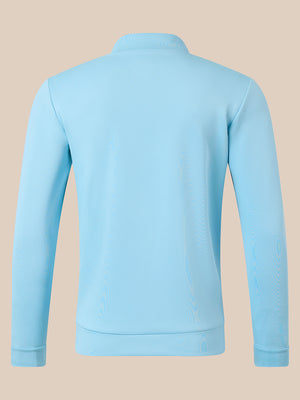 A light blue long-sleeve quarter-zip sweatshirt shown from the back, displayed on a solid beige background.