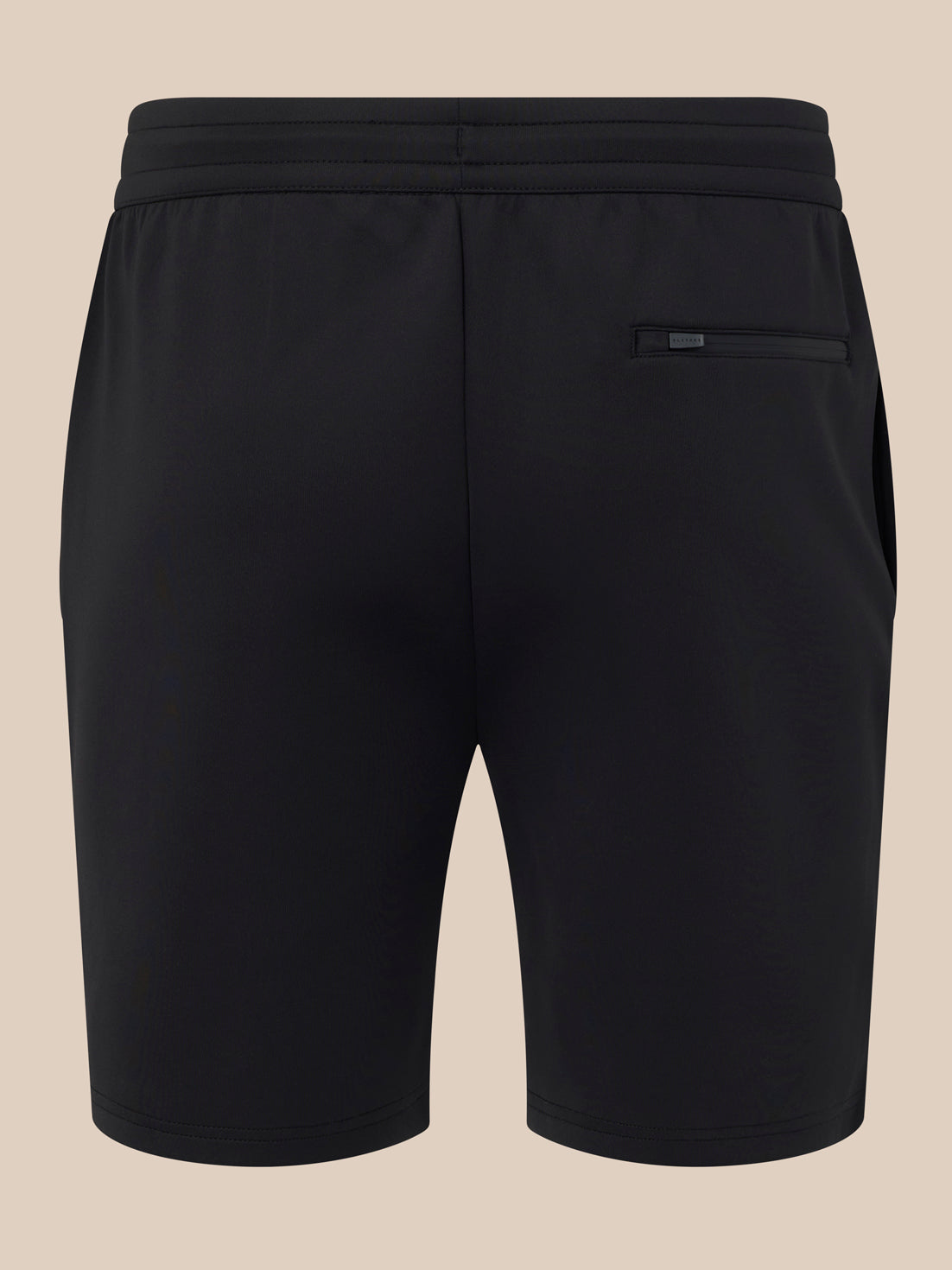 Black shorts on a beige background