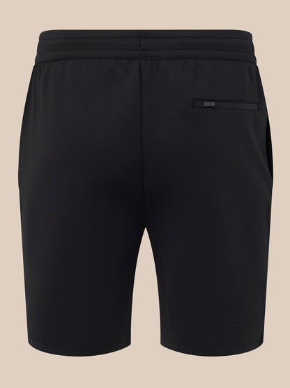Black shorts on a beige background