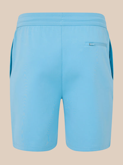 Light blue shorts on a beige background