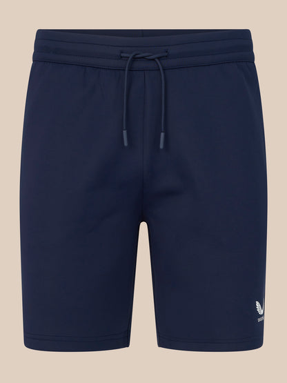 Navy blue shorts with a drawstring on a beige background
