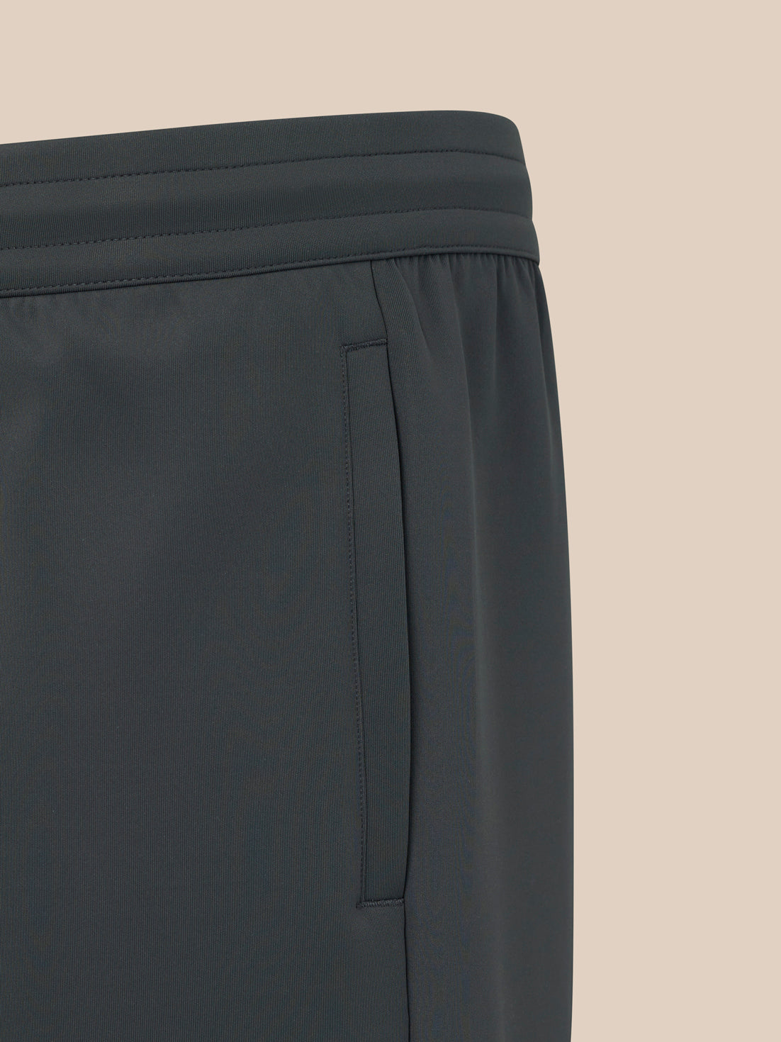 Black pants with a brand logo on a white background
