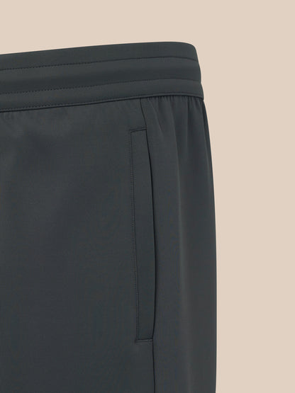 Black pants with a brand logo on a white background