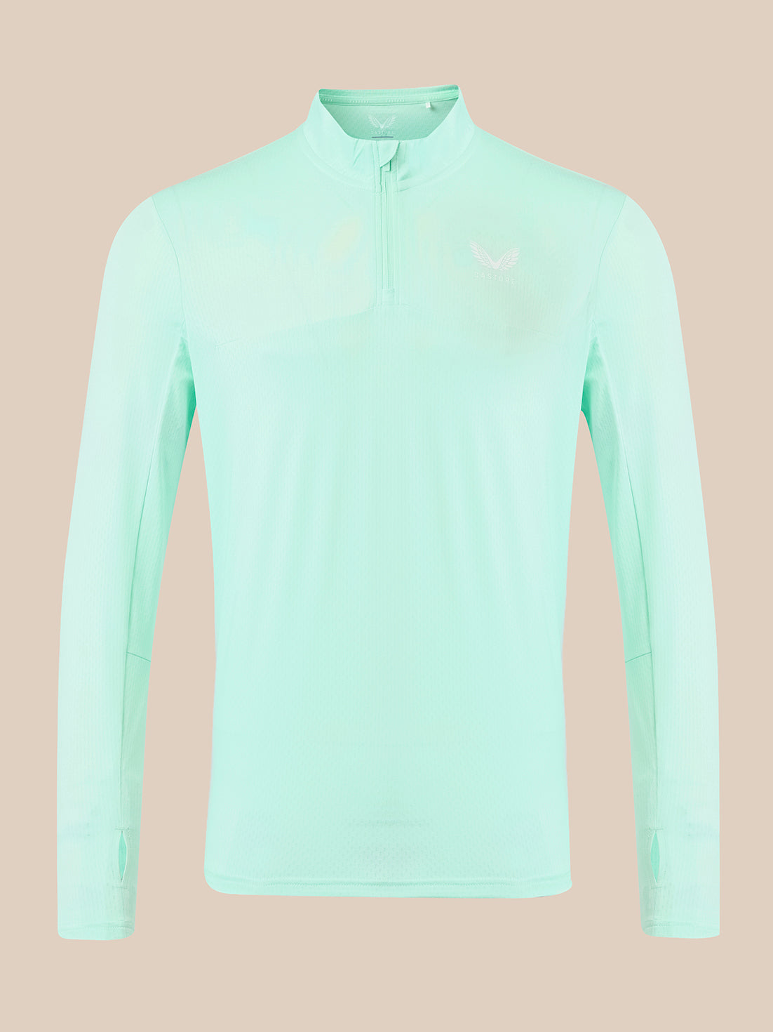 A light mint green long-sleeve athletic quarter-zip pullover with a small white logo on the left chest, displayed on a solid beige background.