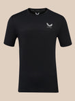 A black short-sleeve athletic t-shirt with a textured knit pattern, featuring a small white wing logo and the brand name 'CASTORE' on the left chest, displayed against a solid beige background.