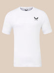 A white short-sleeve athletic t-shirt with a black winged logo and the word 'CASTORE' printed on the left chest, displayed against a solid beige background.