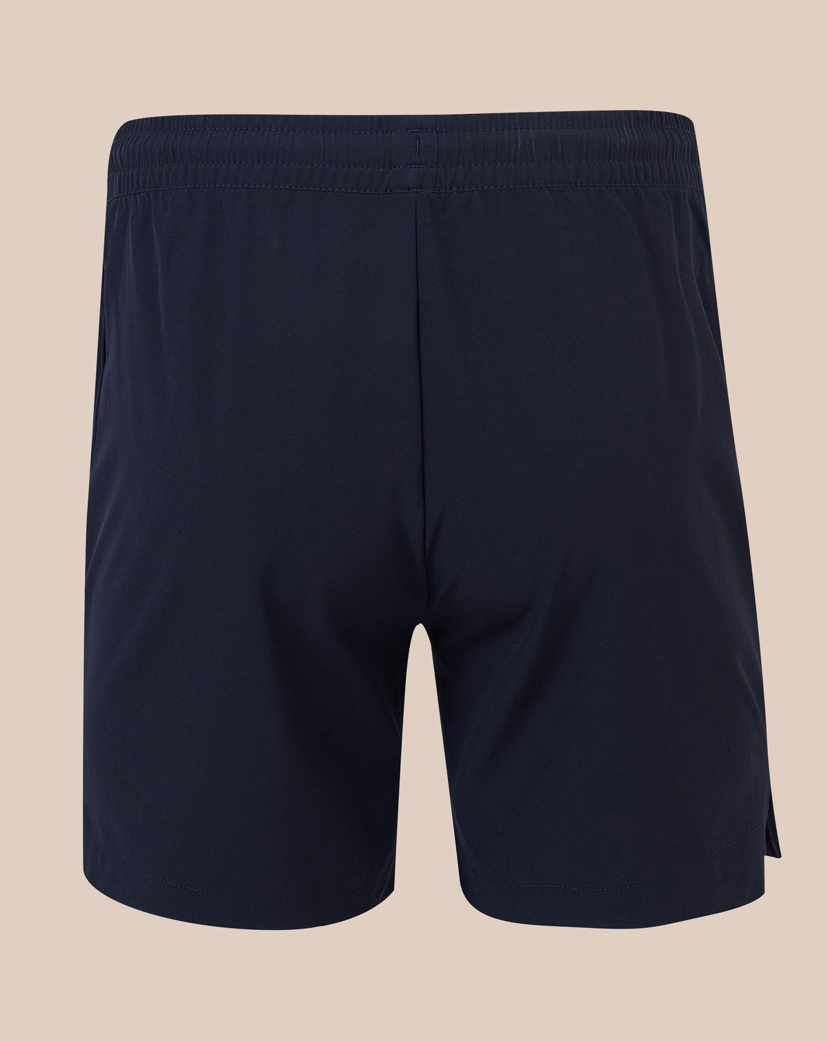 A pair of dark navy athletic shorts with an elastic waistband, shown from the back against a solid beige background.