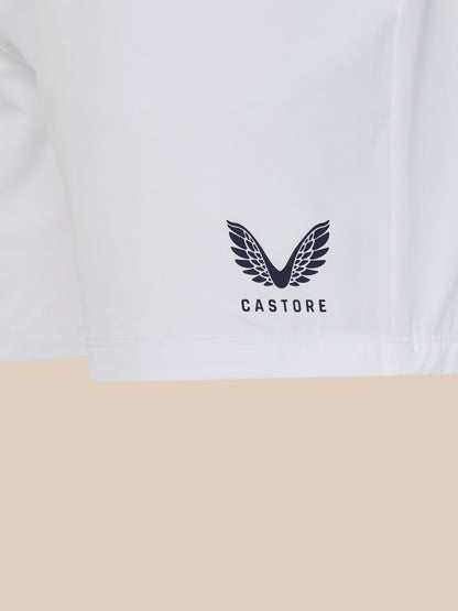 White t-shirt with a black logo and 'Castore' text on a beige background