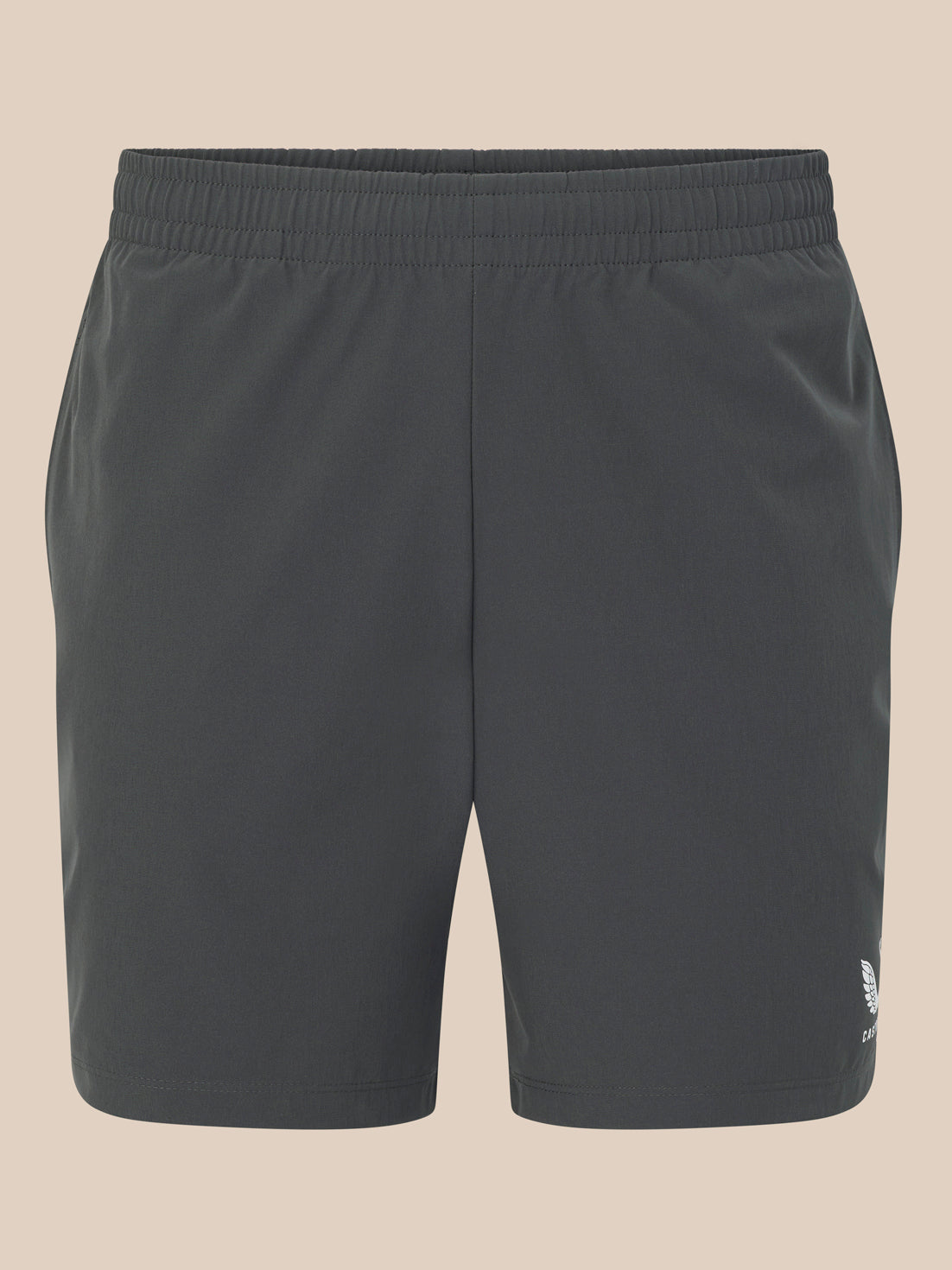 Dark gray shorts with a brand logo on a beige background