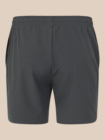 Dark gray shorts on a beige background