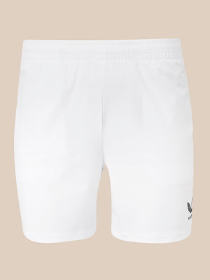 White athletic shorts with an elastic waistband and a small black embroidered logo on the lower left leg, shown against a solid beige background.