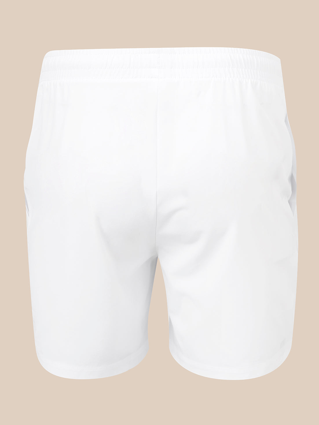 White athletic shorts with an elastic waistband, shown from the back on a solid beige background.