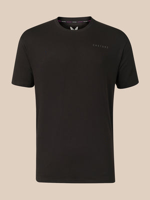 A black short-sleeve crewneck t-shirt with a small tonal 'CASTORE' logo on the left chest, displayed against a solid beige background.