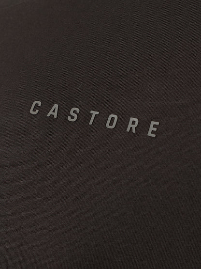Close-up of a dark charcoal gray textured fabric with the brand name 'CASTORE' printed in a light gray sans-serif font across the center.