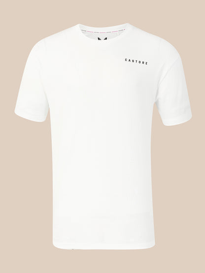 A white short-sleeve crewneck t-shirt with 'CASTORE' printed in small black letters on the left chest, displayed against a solid beige background.
