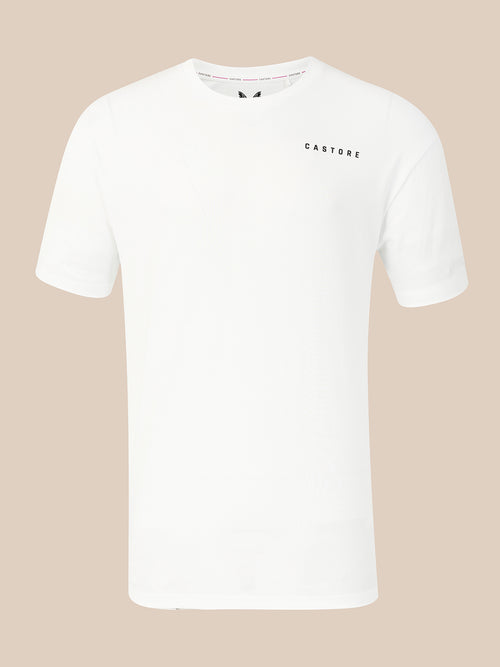 A white short-sleeve crewneck t-shirt with 'CASTORE' printed in small black letters on the left chest, displayed against a solid beige background.