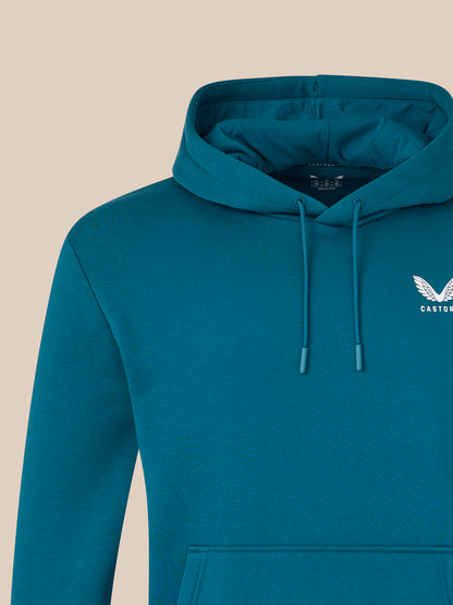 Blue hoodie with a brand logo on a beige background