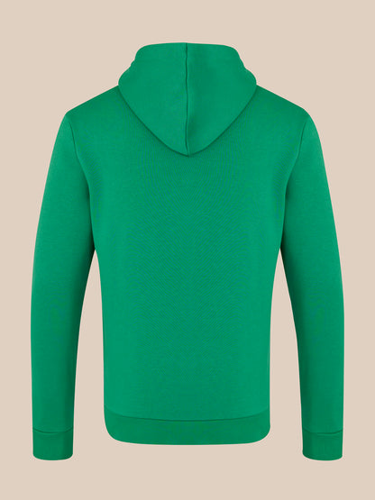 Green hoodie on a beige background