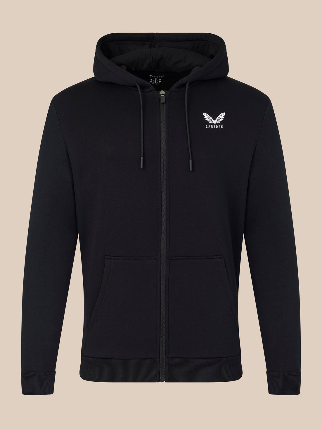 Black hoodie with a logo on the chest against a beige background
