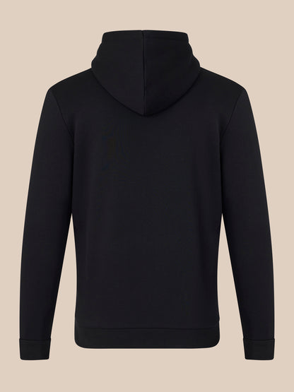 Black hoodie on a beige background
