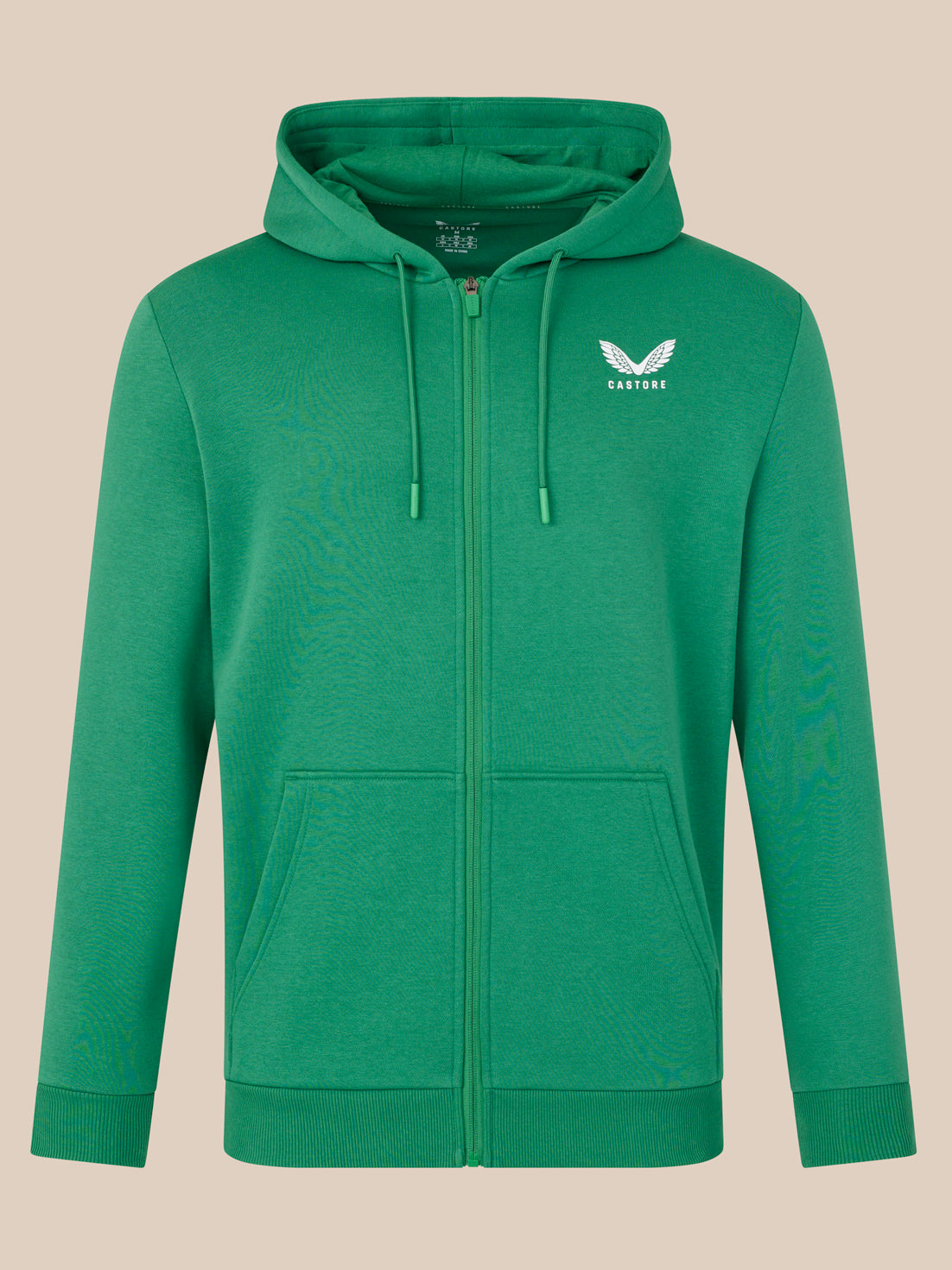Green hoodie with a logo on a beige background
