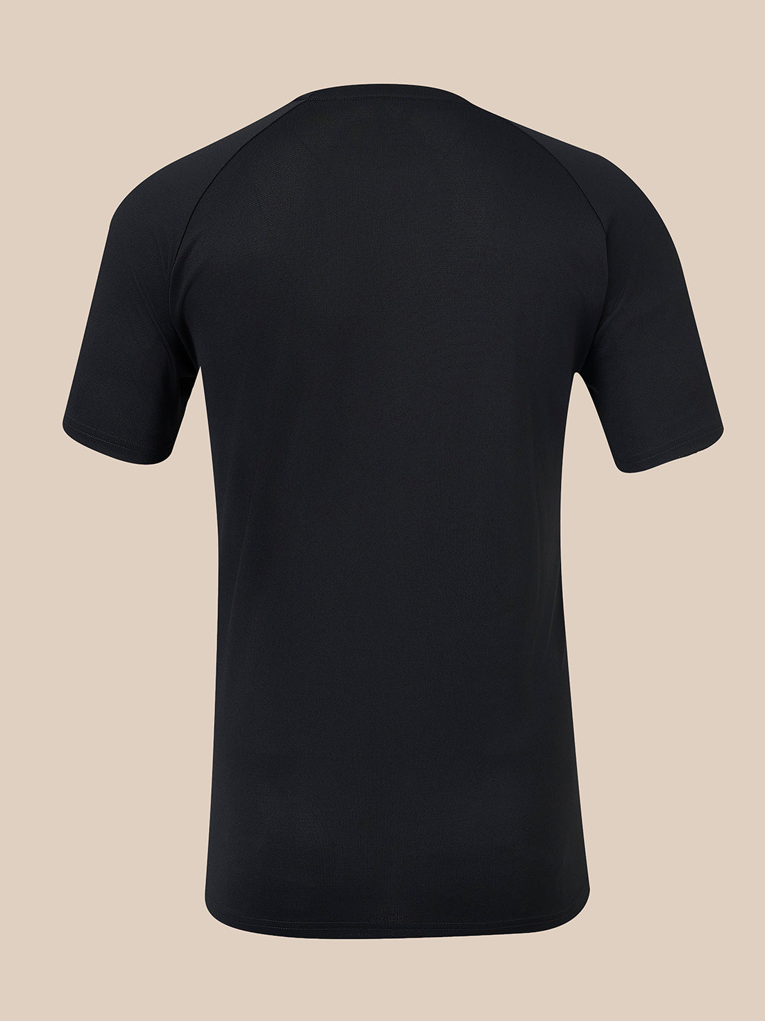 A black short-sleeve athletic t-shirt shown from the back, featuring raglan-style shoulder seams, displayed on a solid beige background.