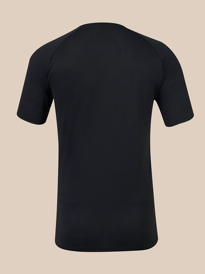 A black short-sleeve athletic t-shirt shown from the back, featuring raglan-style shoulder seams, displayed on a solid beige background.