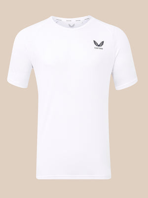 A white short-sleeve crewneck t-shirt with a black winged logo and the word 'CASTORE' printed on the left chest, displayed against a solid beige background.