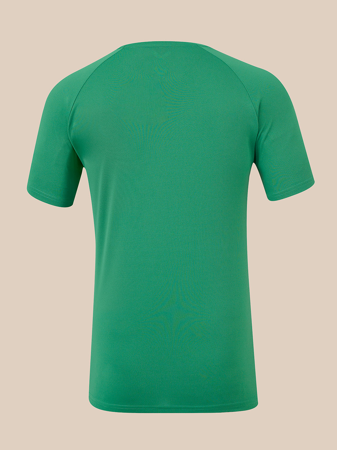 A green short-sleeve athletic t-shirt shown from the back, featuring raglan sleeves and a crew neck, displayed on a solid beige background.