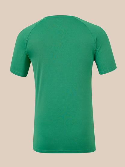 A green short-sleeve athletic t-shirt shown from the back, featuring raglan sleeves and a crew neck, displayed on a solid beige background.