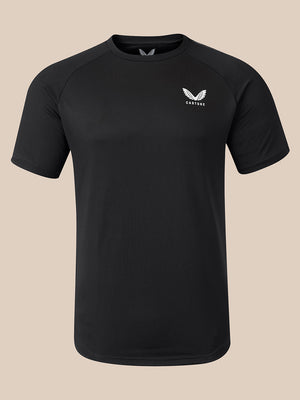 A black short-sleeve athletic t-shirt with a small white wing logo and the word 'CASTORE' on the left chest, displayed on a neutral beige background.