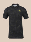 A short-sleeve collared athletic shirt with a black and dark gray palm leaf pattern and yellow accents, featuring a yellow winged logo on the left chest that reads 'CASTORE'.