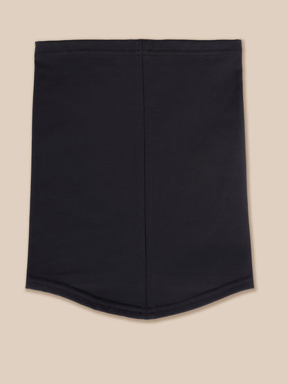 A black athletic snood with a curved hem, laid flat against a solid beige background.
