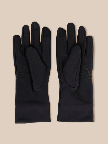 A pair of black long gloves laid flat on a light beige background, showing the back of the hands and a textured grip panel on the backs of the fingers.