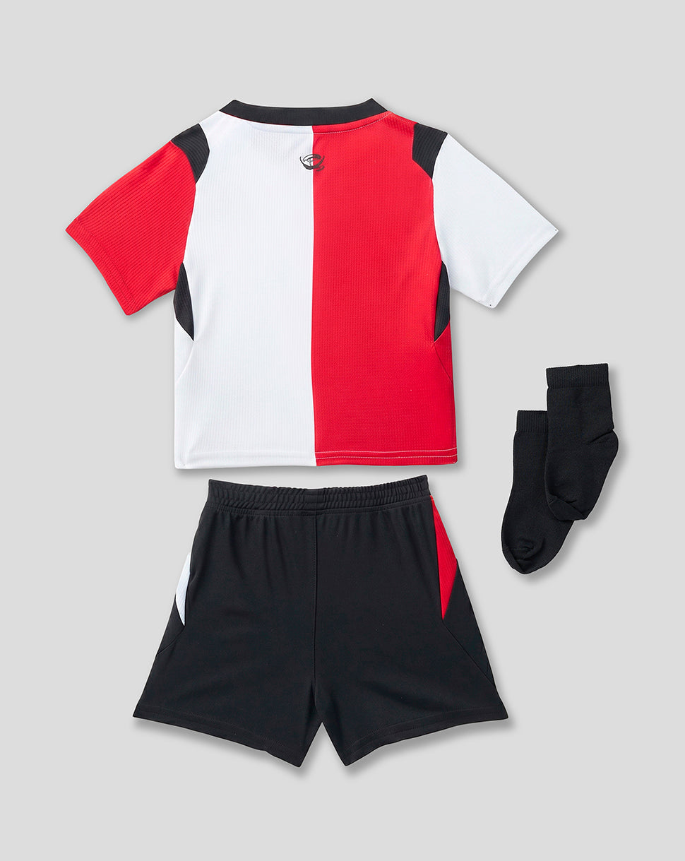 Back view of infant Feyenoord home kit with red white split shirt black shorts and black socks