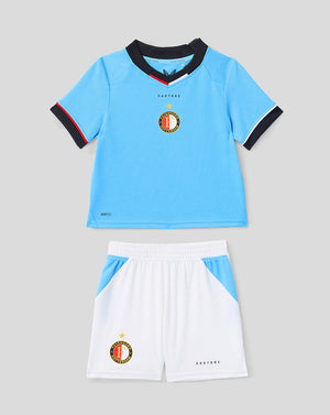 Infant Feyenoord 2026-27 away kit front view with light blue jersey and white shorts bearing the club crest