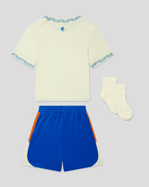 Children's sports outfit with a yellow shirt, blue shorts, and socks on a light gray background