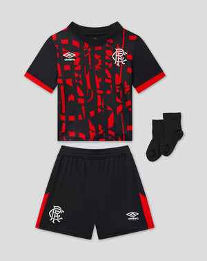 A 3-piece kids' Rangers kit by Umbro, including a short-sleeve patterned jersey, matching shorts, and a pair of black socks, displayed on a light gray background.